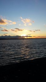 Scenic view of sea at sunset