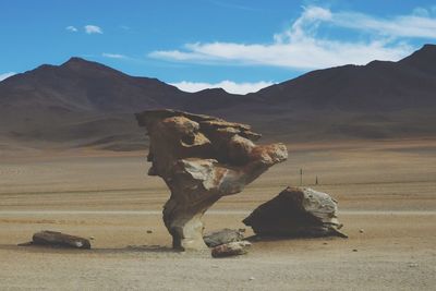 Rock formation on land against sky