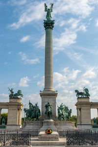 Low angle view of statue against cloudy sky