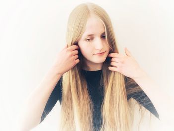 Portrait of a beautiful young woman over white background