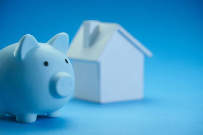 Close-up of white toy against blue background