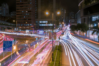 High angle view of light trails on city street at night
