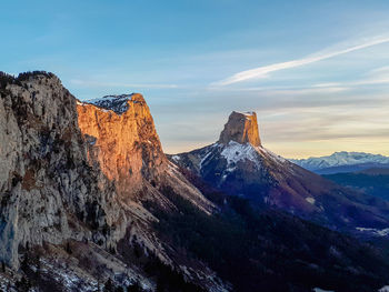 Scenic view of snowcapped mountains against sky during winter