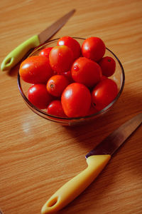 High angle view of cherries in bowl on table