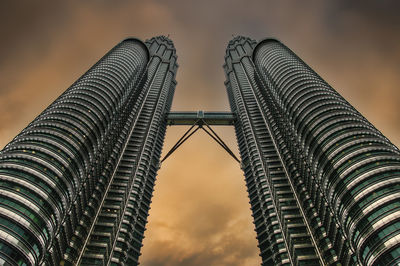 Low angle view of modern buildings against sky during sunset