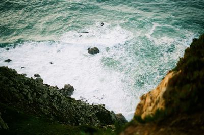 High angle view of rocks at sea