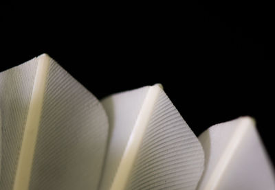 High angle view of book on table against black background