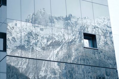 Low angle view of building against sky during winter