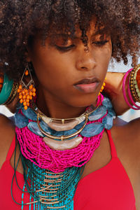 Portrait of a young black woman wearing colorful jewelry