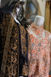 Close-up of clothes hanging on display at store