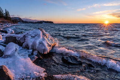 Scenic view of sea against sky during sunset