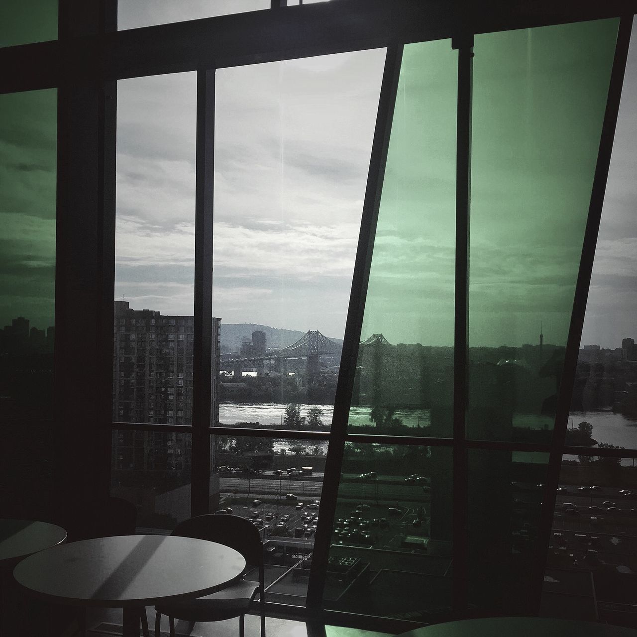 window, glass - material, transparent, indoors, sky, no people, day, architecture, built structure, cloud - sky, nature, city, water, cityscape, table, building, chair, glass, apartment