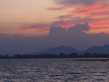 Scenic view of sea against romantic sky at sunset