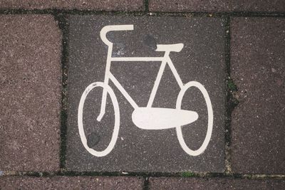 High angle view of bicycle sign on road