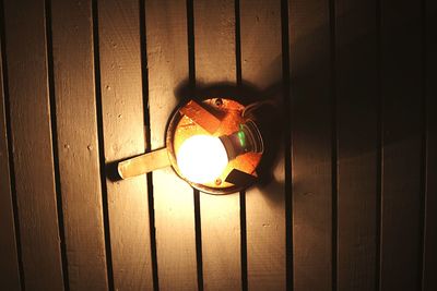 Close-up of illuminated lamp on ceiling