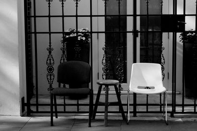 Empty chairs and tables in building