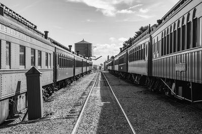 Train on railroad tracks against sky