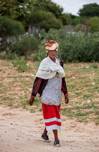 Full length of girl standing on field