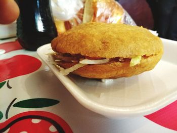 Close-up of burger in plate on table