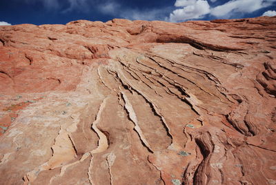 Close-up of cracked landscape against the sky