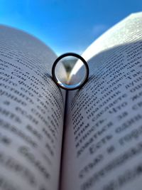 Close-up of ring in book