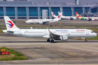 View of airplane at airport runway