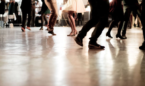 Low section of people dancing on floor