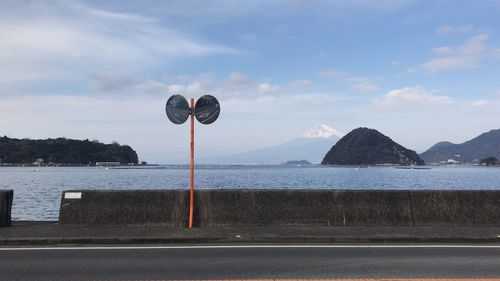 Road by sea against sky