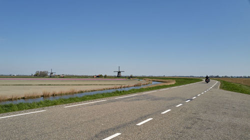 View of country road against clear sky