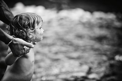 Close-up of adult guiding toddler