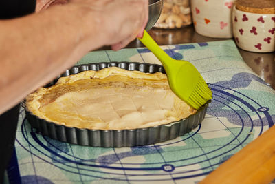 Midsection of man preparing food on table