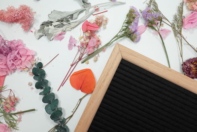 High angle view of various flowers on table