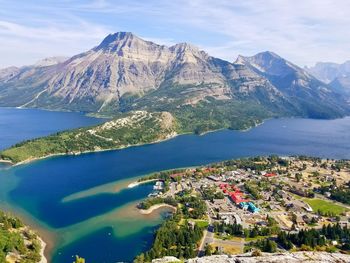 High angle view of sea and mountains against sky
