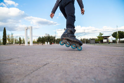 Low section of man skateboarding on skateboard