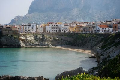 View of sea and buildings in city