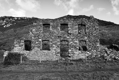 Low angle view of old ruins against sky