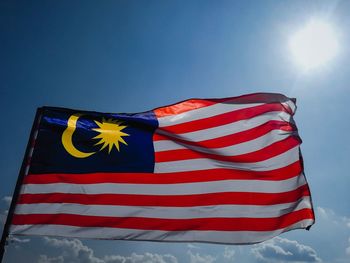 Low angle view of malaysian flag against sky
