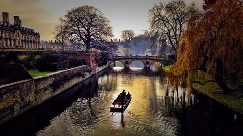 Bridge over river with buildings in background