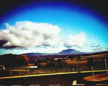 Panoramic view of landscape against blue sky