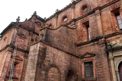 Low angle view of old building against sky