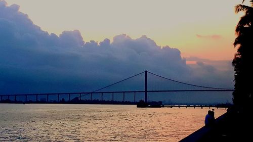 View of suspension bridge over sea