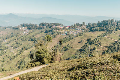 Scenic view of landscape and mountains against sky