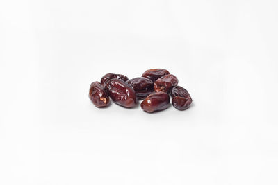 Directly above shot of coffee beans against white background