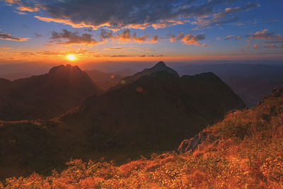 Scenic view of mountains against sky during sunset