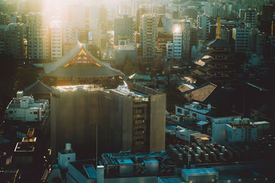 High angle view of illuminated buildings in city at night