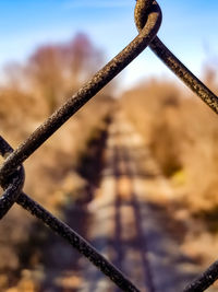 Close-up of metal against sky