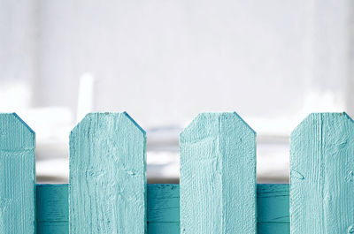 Close-up of wooden fence against sky