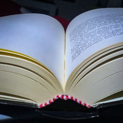 Close-up of heart shape on book