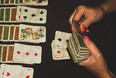 Close-up of woman playing cards