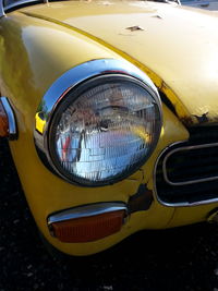 Close-up of yellow car